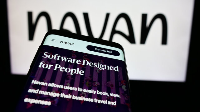 Stuttgart, Germany - 05-17-2024: Smartphone with website of US travel management software company Navan Inc. in front of business logo. Focus on top-left of phone display.