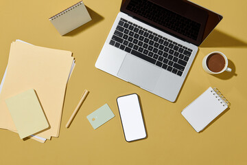 Overhead shot computer laptop, notebook, credit card and coffee cup