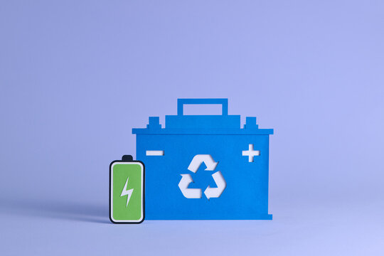 Blue and green paper craft of battery and Accumulator battery icon