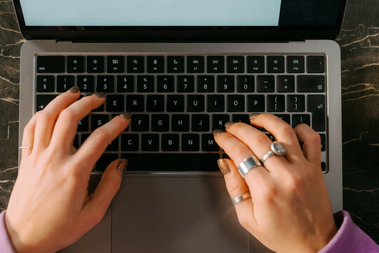 Women hands on laptop keyboard