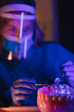 A dental technician practices