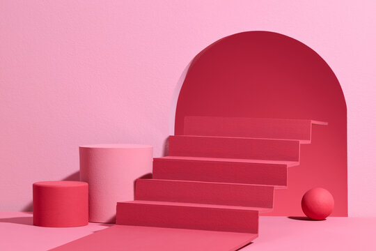 Red and pink scene with stairs and podium