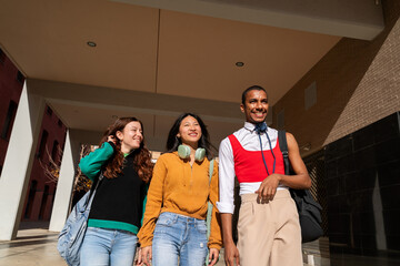 Group of happy student friends outdoors