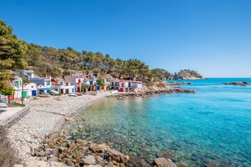View of a small fishing village on the Costa Brava, in Girona, Catalonia. Mediterranean, on the shore of a rocky beach.
