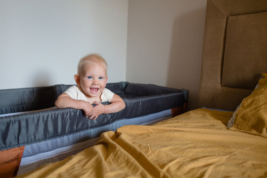 Infant in the baby cot