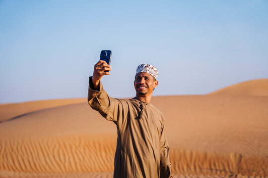 Man Taking Selfie in Desert