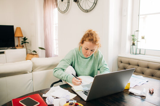 Focused woman studing at home