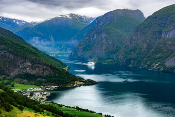 Fototapeta premium A big cruise liner in Sunnylvsfjorden fjord near Geiranger village in western Norway