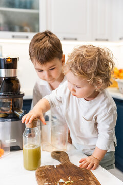 Two kids with juice 