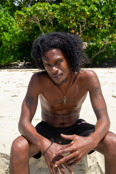 Portrait of a male model looking at the camera by the sea