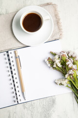Little white Coffee cup and notepad morning planning