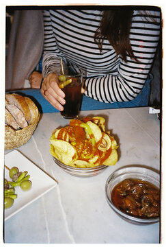 Woman's hand with vermouth sitting in a bar 