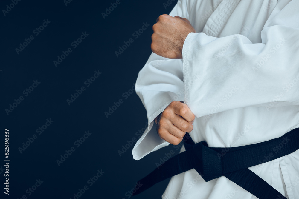 Canvas Prints Man, hands and ready for karate in studio, fighter and start for training or practice on dark background. Male person, athlete and warrior in dojo for martial arts, mockup space and sports technique