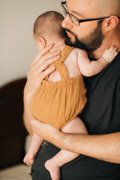 Father holding his baby girl