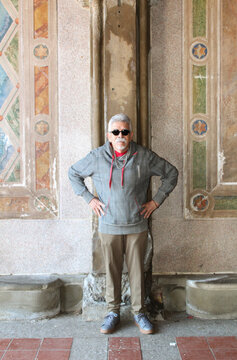 Senior Man With Sunglasses and Hands on Hips