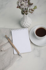 Little white Coffee cup and notepad morning planning
