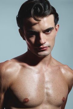 Fit male model with slick hair and glowing skin