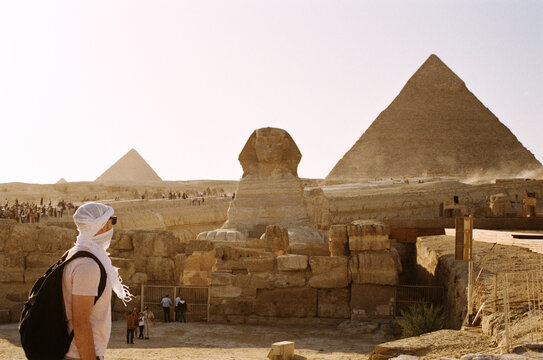Tourist Contemplating the Sphinx and Pyramids at Giza