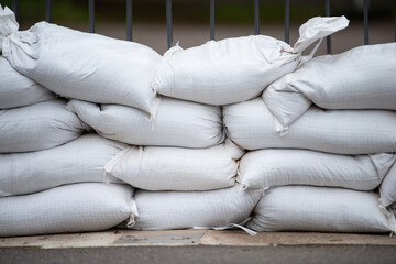Sandbags for flood defense, river Moselle Trier in Rhineland Palatinate, flooded trees and paths,...