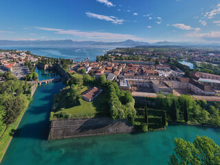 Aerial view of the town of Peschiera del Garda located on the shores of Lake Garda. City on the water Italy. Resorts on Lake Garda Italy. Aerial panorama on the lake.