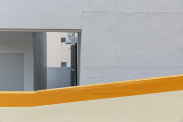 Entrance to the stairs of the gray building.