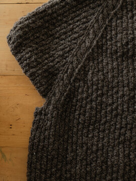 Close up of sweater being knit from handspun yarn