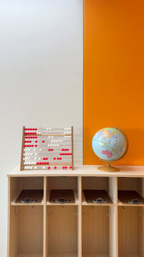 School classroom with abacus and globe 