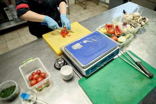 close-up of chef working at the kitchen