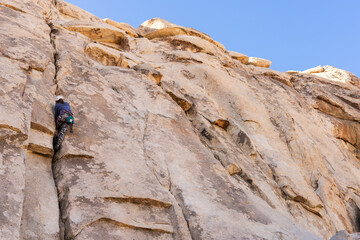 Woman rock climbing in Joshua Tree National Park