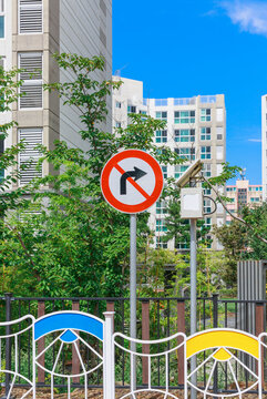 No right turn sign on city street.