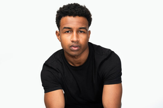 Reflective Young Man in Studio