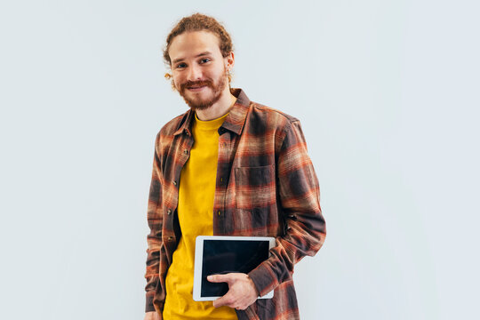 Casual Businessman with Tablet in Contemporary Office