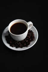 Little white Cup of black expresso coffee