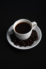 Little white Cup of black expresso coffee