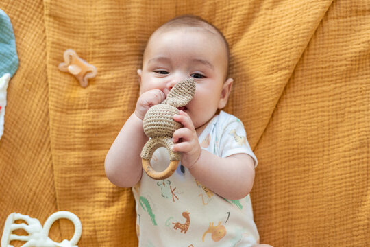 baby with teether 
