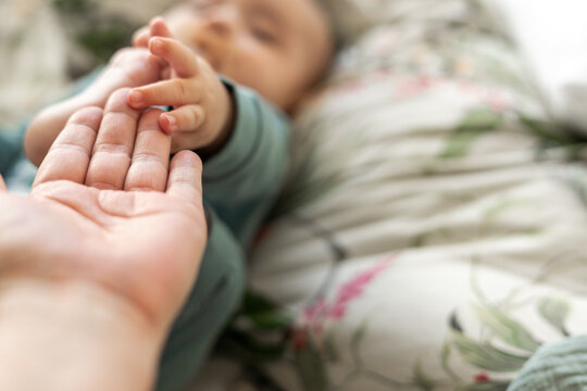  Baby Holding mom's Finger