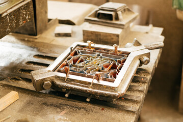 Close-Up of Industrial Cement Tile Mold on Workbench in Daylight