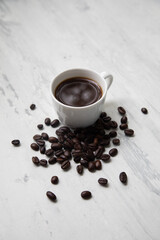 Little white Cup of black expresso coffee