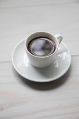 Little white Cup of black expresso coffee