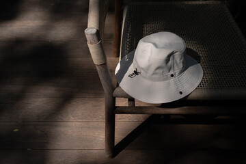 Resting chair with a white hat in the sunlight