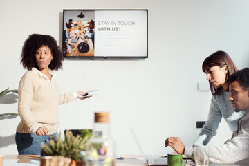 Focused Team Engaged in Interactive Presentation