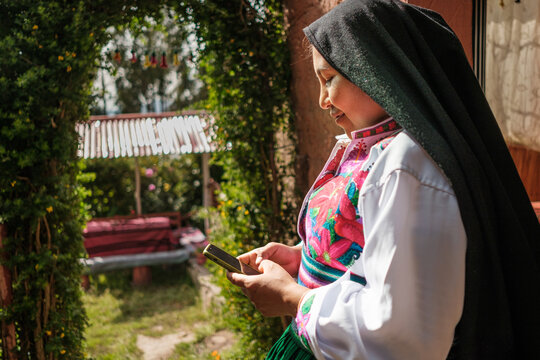peruvian woman Using her phone