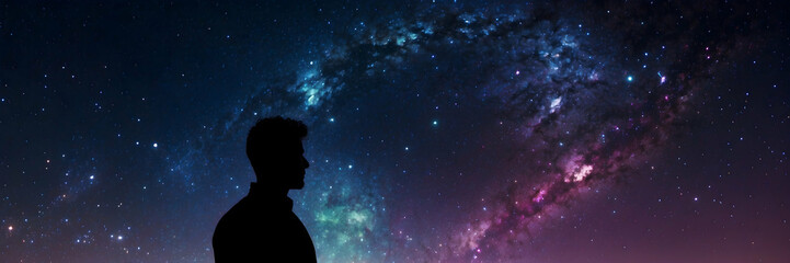 A silhouette of a person is outlined against a vast starry sky, evoking a sense of wonder and exploration