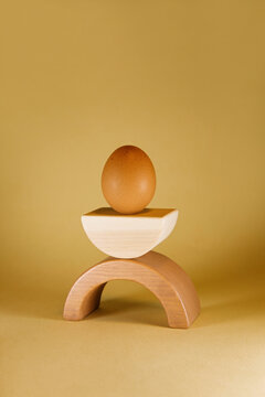 Egg on Wooden Stand
