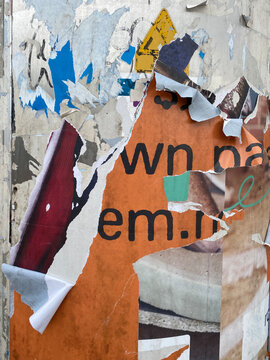 wall with torn posters