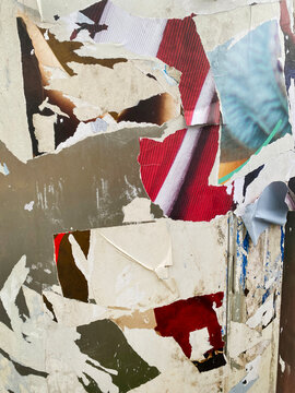 wall with torn posters