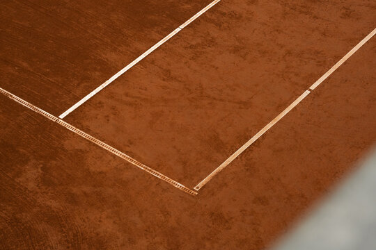 Tennis court with balls and lines.