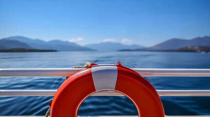 Serene Nautical Escape: Lifebuoy on a Boat Overlooking Tranquil Waters