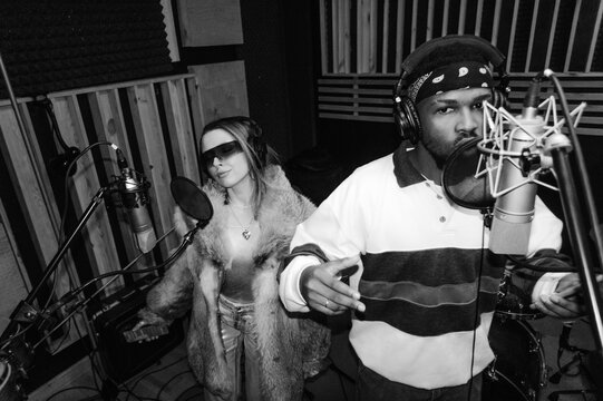 A man and a woman in a recording studio