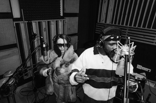 A man and a woman in a recording studio